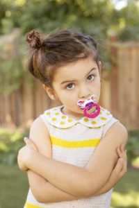 girl with pacifier